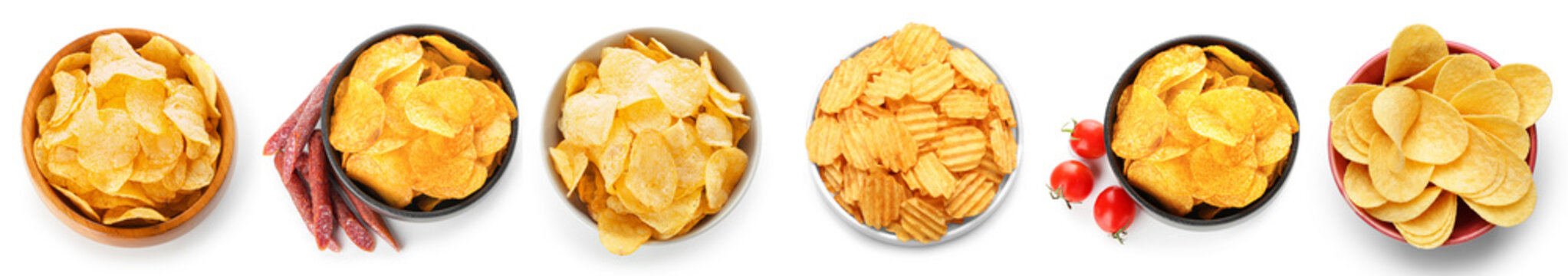 Bowl with different tasty potato chips on white background, top view