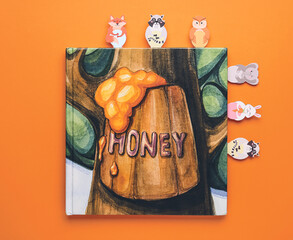 Book with cute bookmarks on color background