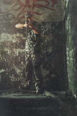 Airsoft svintageier in the vintage industry building. Old photo effect.