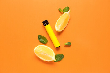 Disposable electronic cigarette, mint leaves and lemon on orange background