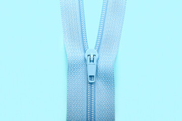Stylish zipper on blue background