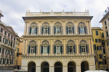 Fototapeta na wymiar Old building in front of Saint Lawrence (Lorenzo) Cathedral at Via S. Lorenzo in Genoa, Italy