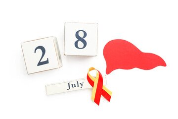 Awareness ribbon, paper liver and cube calendar with date 28 JULY on white background. World Hepatitis Day