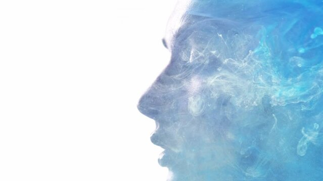 Spiritual aura. Inner peace. Enlightenment mindfulness. Double exposure closeup profile silhouette of relaxed woman face with blue mist cloud isolated on white copy space.