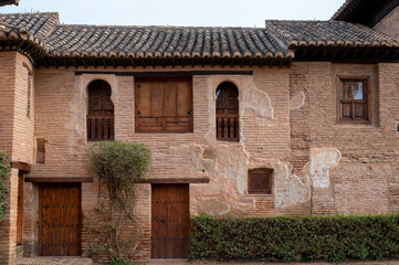 Fototapeta na wymiar Walls, gardens and buidings of medieval fortress Alhambra, Granada, Andalusia, Spain