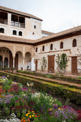 Obraz premium Gardens and buidings of medieval palace Generalife in fortress Alhambra, Granada, Andalusia, Spain