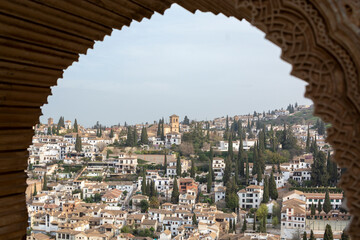 View from medieval fortress Alhambra to white houses of Albaicin, Granada, Andalusia, Spain - obrazy, fototapety, plakaty