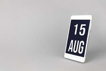 August 15th. Day 15 of month, Calendar date. Smartphone with calendar day, calendar display on your smartphone. Summer month, day of the year concept.