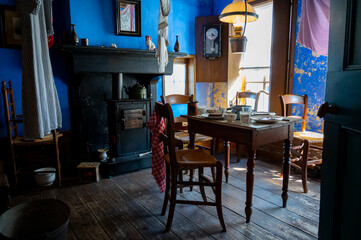 Old fashioned wooden chairs and table in sunlights, Dutch interior and room decoration in rich fisherman's house in North-Holland, Enkhuizen, Netherlands