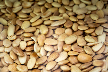 Roasted peeled almonds nuts, tasty healthy vegetarian food