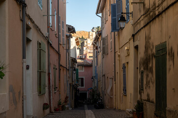 Fototapeta premium Sunny day in South of France, walking in ancient Provencal coastal town Cassis, narrow streets and colorful buildings, Provence, France