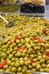 Assortment of pickled green olives on farmers market in Malaga, Andalusia, Spain