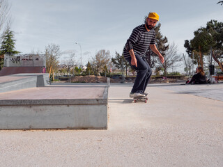 Focused man enjoying his skatepark ride