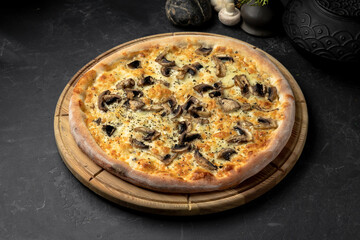 Delicious pizza with cheese and mushrooms on stone table