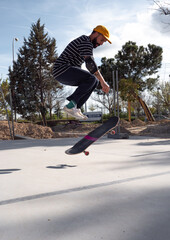 Skilled man executing tricks on a skateboard