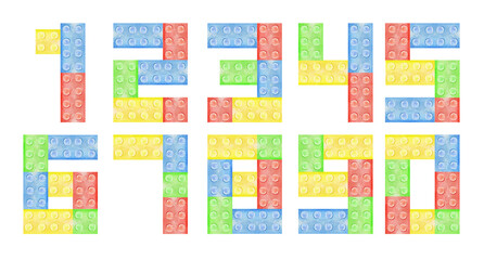 Watercolor number 9 from plastic building blocks. Colored digit nine of toy bricks isolated on white background