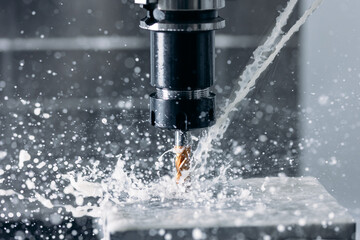 Working closeup CNC turning cutting metal Industry machine iron tools with splash water