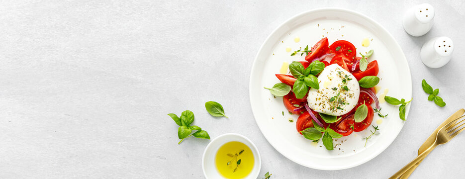 Salad Caprese with tomato, mozzarella and basil,. Top view. Banner