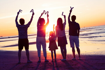 Happy families on holiday at the seaside