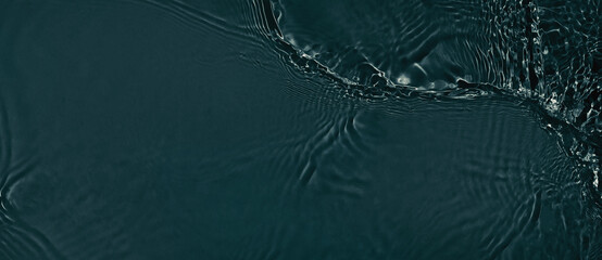 Black transparent clear calm water surface texture with ripples, splashes. Abstract nature banner...