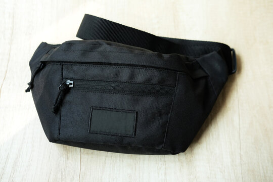 Black men's waist bag on the table