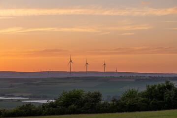 wind turbines at sunset