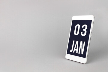 January 3rd. Day 3 of month, Calendar date. Smartphone with calendar day, calendar display on your smartphone. Winter month, day of the year concept.