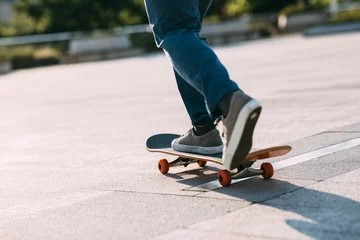 Zelfklevend Fotobehang Skateboarder skateboarding outdoors in city © lzf
