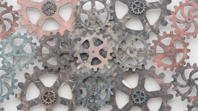 transmission rotation of time machine gear mechanism of gears pinion on white wall transmit rotation