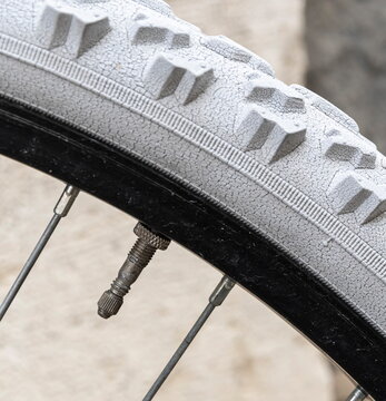 Close up on bicycle wheel air valve, nipple