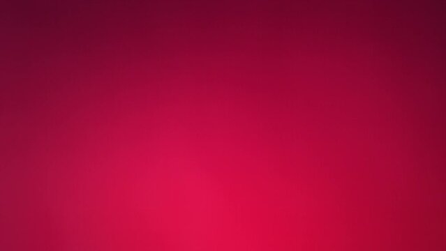 Flying of Pomegranate in Fuchsia Background in Slow Motion