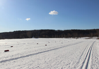Fototapeta na wymiar Empty ski run on a sunny winter day