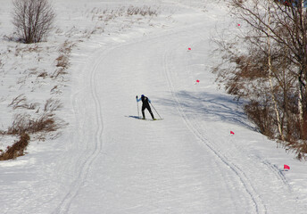 Skiers on a snowy ski run