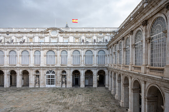 Inner courtyard of the Royal Palace of Madrid, there is a flag of Spain