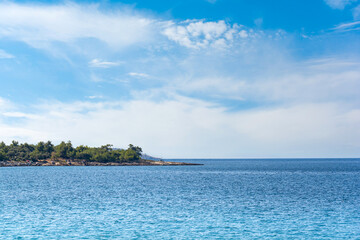 Beautiful blue color sea in the background and cloudy sky in the background