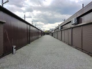 Rows of closed shutters of security shops and kiosks in the future.