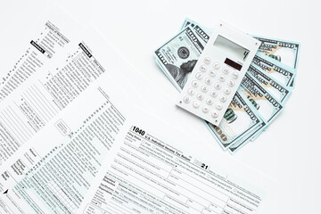 Annual tax form under US law with money cash. Tax payment season