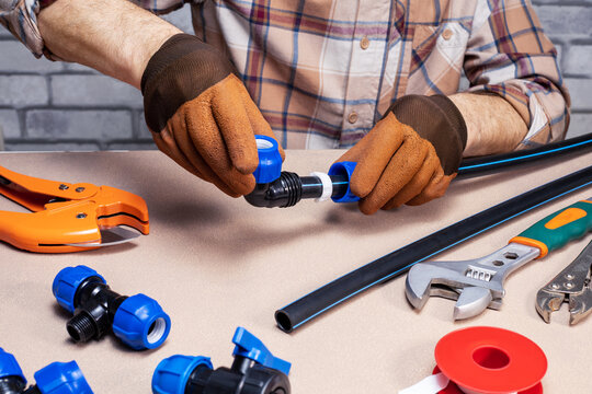  plumber connects the fittings to the pupe. plumbing repair service. small business.