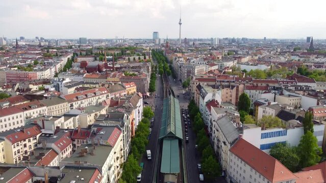 Start at TV tower ends at elevated train subway enters the picture Marvelous aerial view flight slowly tilt down drone footage of Berlin Prenzlauer Berg Sch&ouml;nauer Allee Spring 2022. by Philipp Marnitz