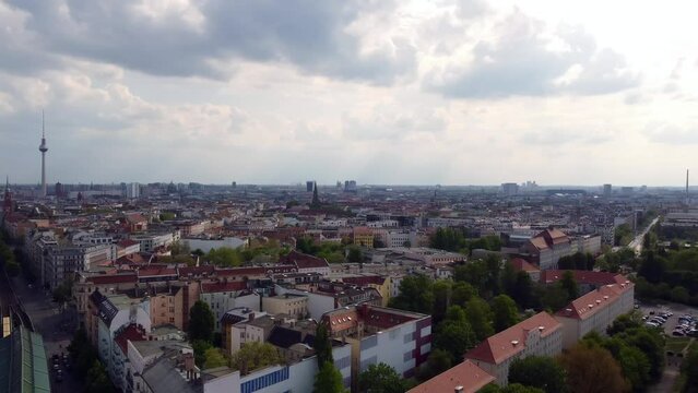 Overview panorama TV Tower, Mauerpark and Jahn Sportpark. Beautiful aerial view flight panorama curve drone footage of Berlin Prenzlauer Berg Sch&ouml;nauer Allee Spring 2022 Cinematic by Philipp Marnitz