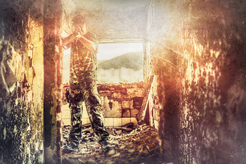 Airsoft sgrungeier in the grunge industry building. Old photo effect.