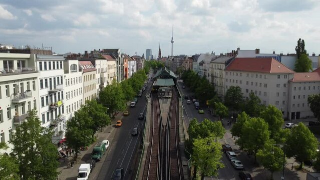 Berlin Eberswalder Stra&szlig;e, panoramic TV Tower, rooftop, bird flying.
Buttery soft aerial view flight hover drone footage in Prenzlauer Berg Sch&ouml;nauer Allee Spring 2022. Cinematic by Philipp Marnitz