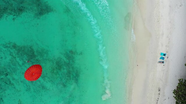 Aerial view of Coral island, koh He, beach and boats in Phuket province, Thailand