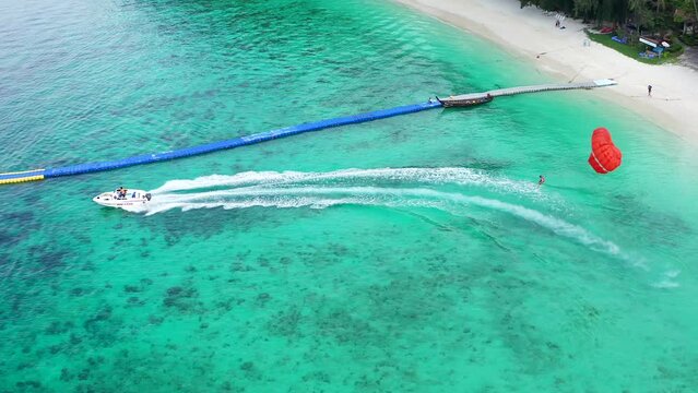 Aerial view of Coral island, koh He, beach and boats in Phuket province, Thailand