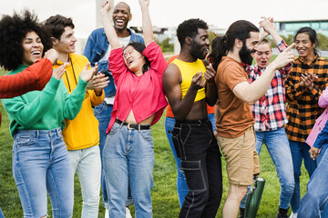 Young diverse people having fun outdoor dancing together - Focus on asian girl face - Powered by Adobe