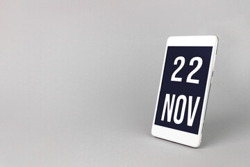 November 22nd. Day 22 of month, Calendar date. Smartphone with calendar day, calendar display on...