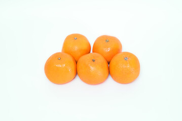Five ripe juicy tangerines isolated on white background. Healthy food.