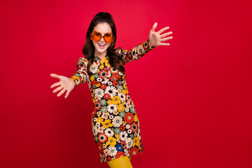Photo of shiny excited woman wear flower print dress hear eyewear open arms empty space isolated...