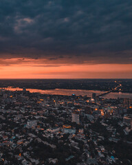 Dnipro, Ukraine. View of the central part of the city of the Dnieper. Top view from a great height. Panoramic view of the city. Dawn or sunset over the city. orange sky