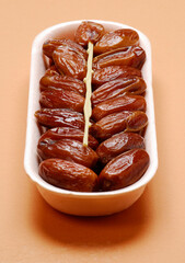 Fresh Tunisian dates container and plastic stick
